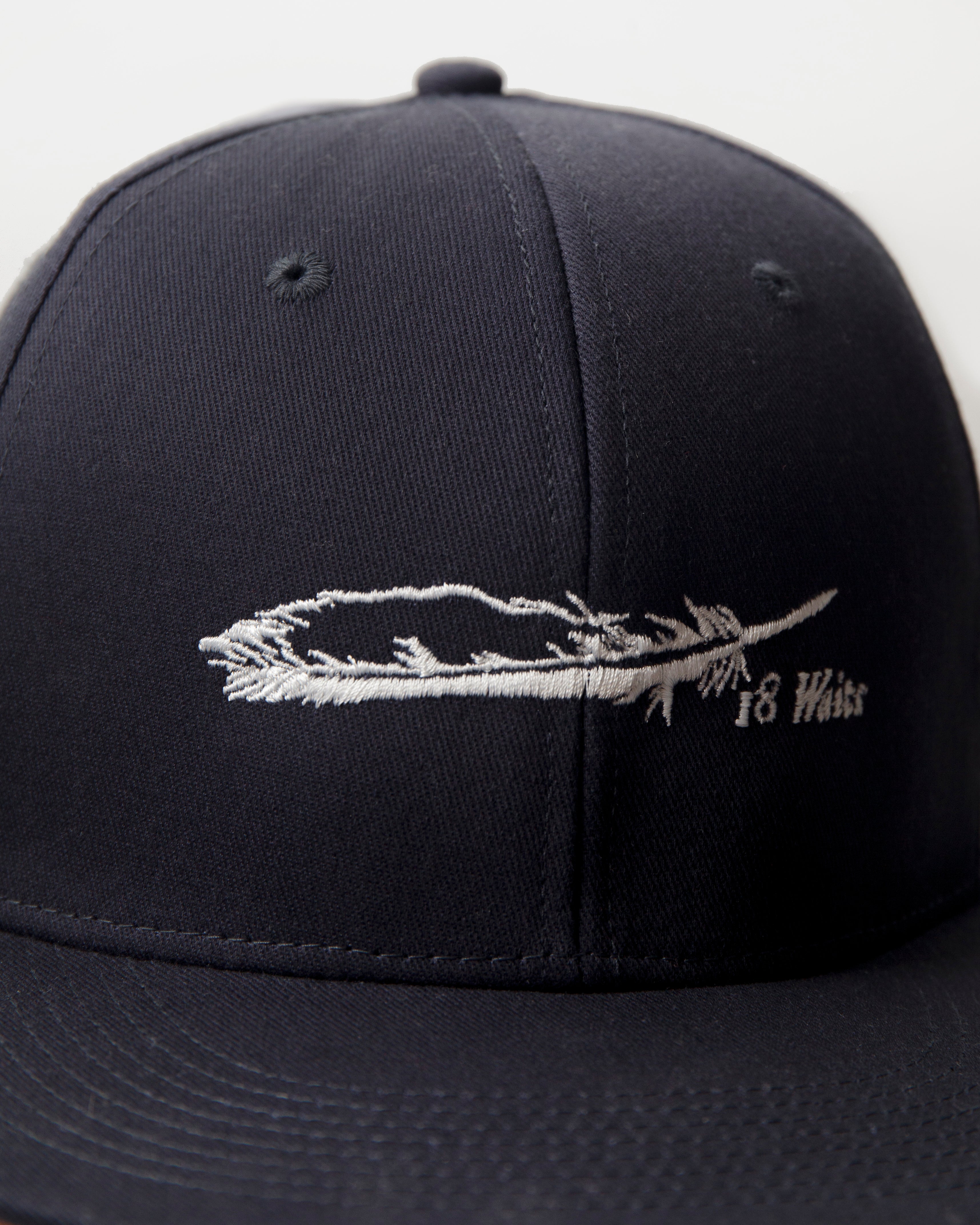 Flat Bill Snapback Cap | White Feather Logo on Navy